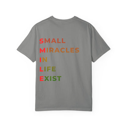Smile Pocket Tee — “Small Miracles in Life Exist” Inspirational Graphic T-Shirt